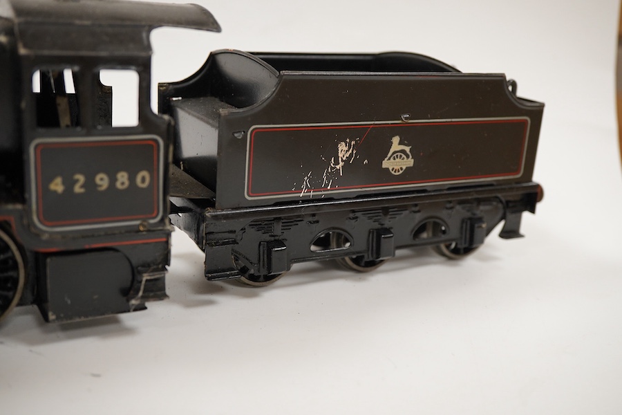 An 0 gauge Bassett-Lowke live steam spirit fired tinplate BR 2-6-0 Mogul tender locomotive, 42980, with original fuel tank and burner, two controls in the cab accessed through the cab roof